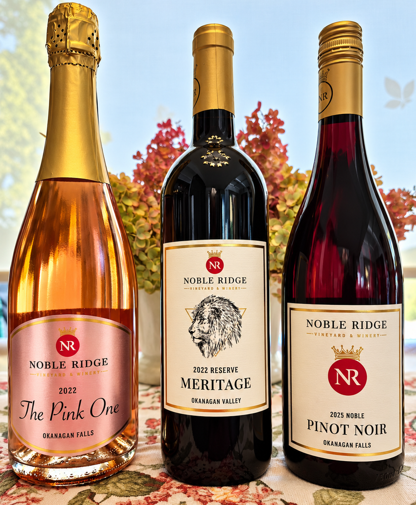 Noble Ridge wines: the elegant 2022 The Pink One Sparkling Rosé, the fruit-forward 2025 Noble Pinot Noir, and the structured 2022 Reserve Meritage.